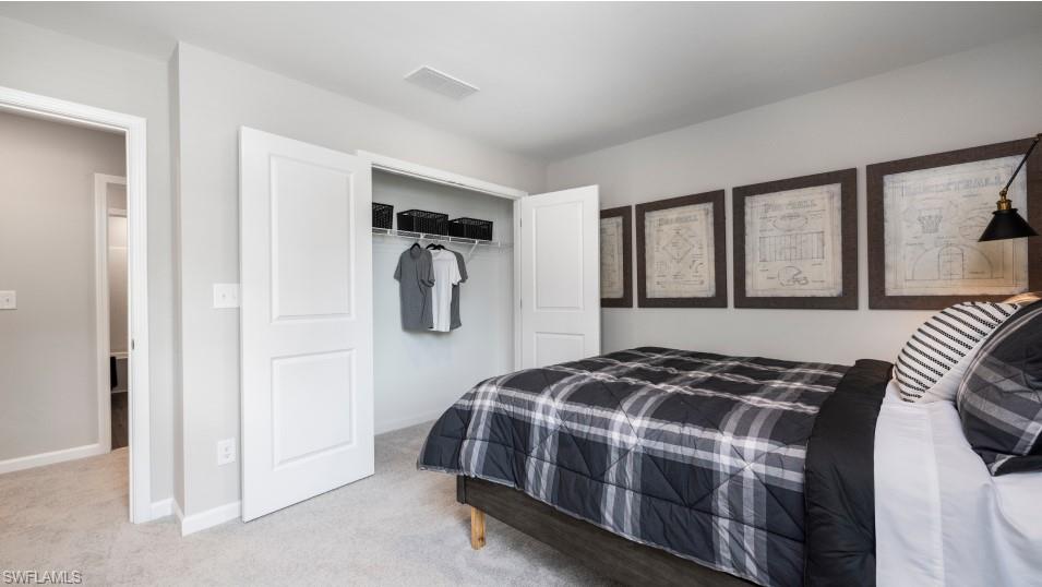 12240 Dakota Ridge Place North Fort Myers, FL 33917 - Photo 26 of 32 a bedroom with a bed and a window
