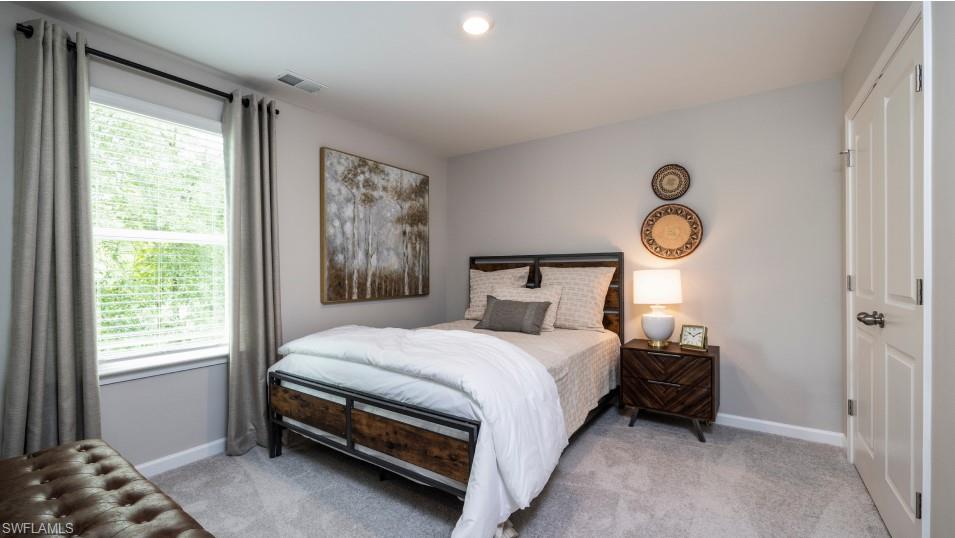 12240 Dakota Ridge Place North Fort Myers, FL 33917 - Photo 29 of 32 a bedroom with a bed and a window
