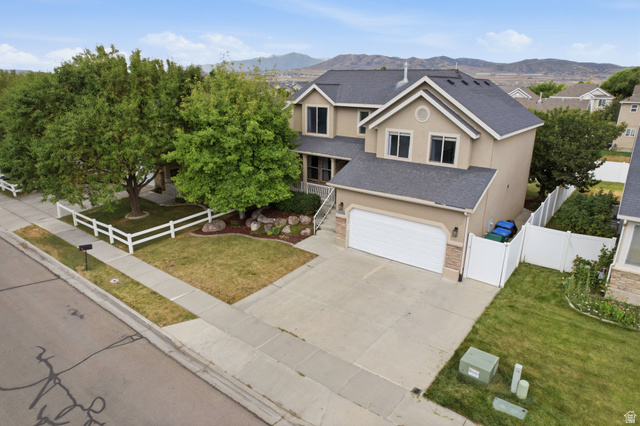 2223 North Pointe Meadow Loop Lehi, UT 84048 - Photo 47 of 56 Two-story residence featuring a two-car garage with an automatic door