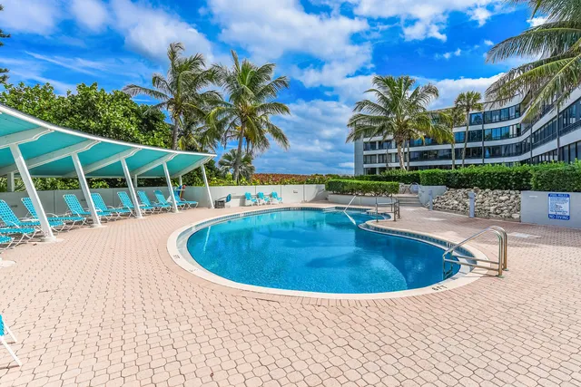 a view of a swimming pool with a patio