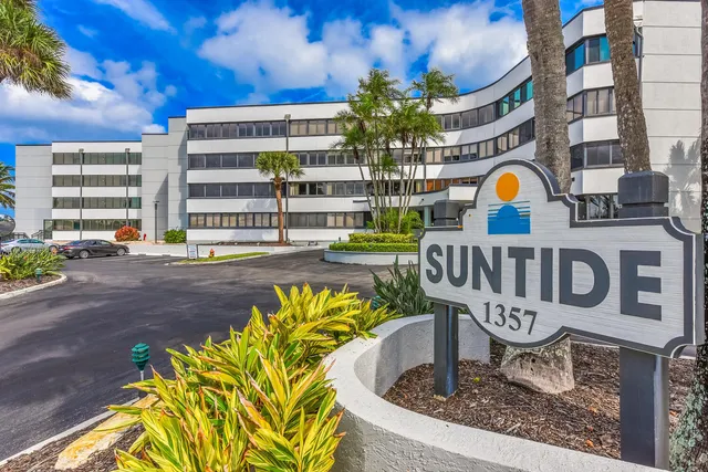a bathroom with a shower and mirror