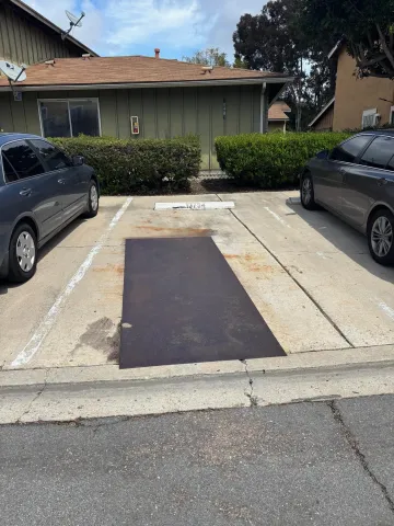 a view of a car parked in front of a house