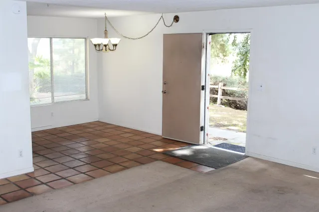 a view of a bedroom and window