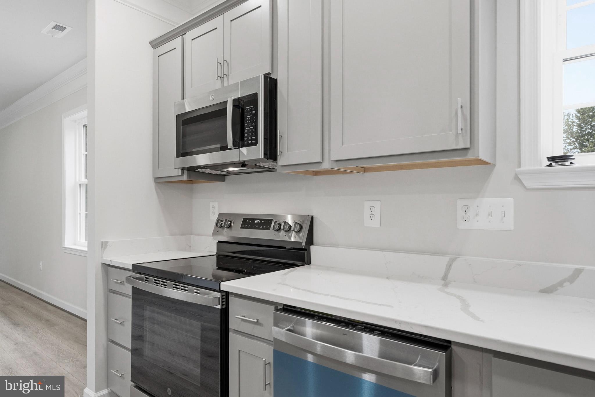 29725 Bruce Road Mechanicsville, MD 20659 - Photo 46 of 79 a kitchen with a stove and a microwave