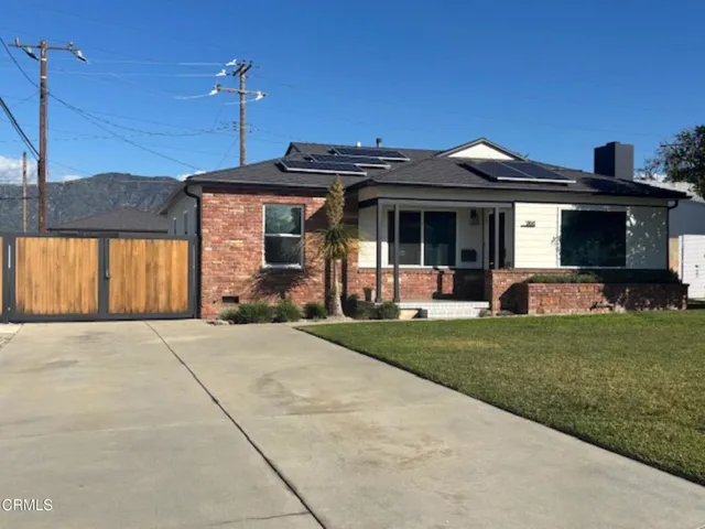 a view of a house with a garden