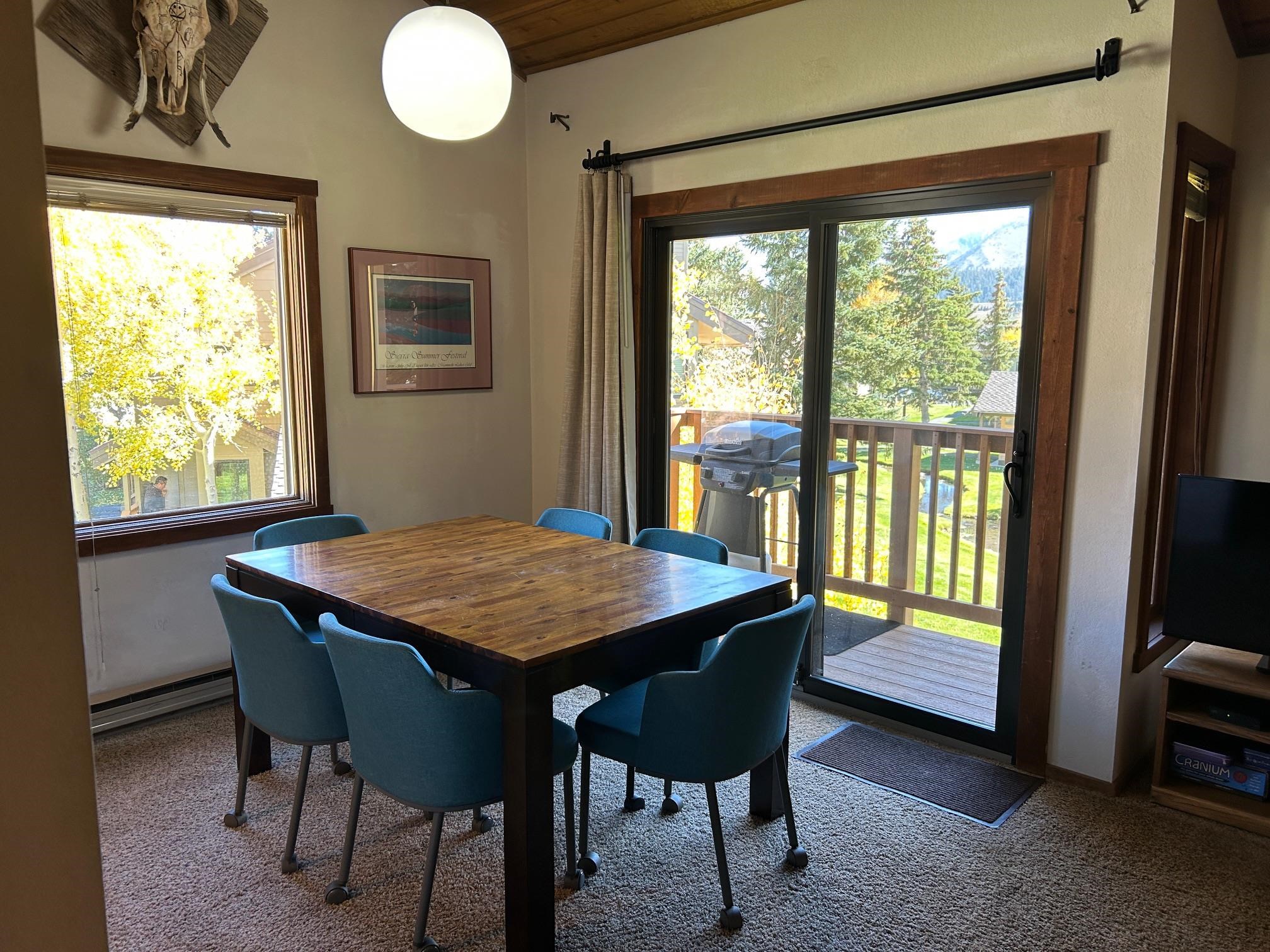 266 Snowcreek Road, Unit 266 Mammoth Lakes, CA 93546 - Photo 13 of 27 a dining room with a window and furniture