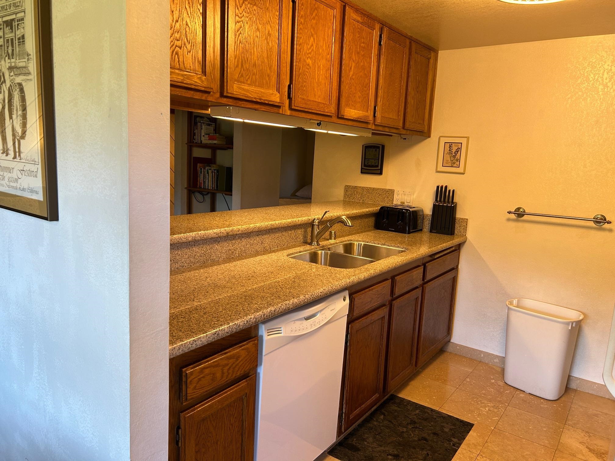 266 Snowcreek Road, Unit 266 Mammoth Lakes, CA 93546 - Photo 14 of 27 a kitchen with a sink and a stove