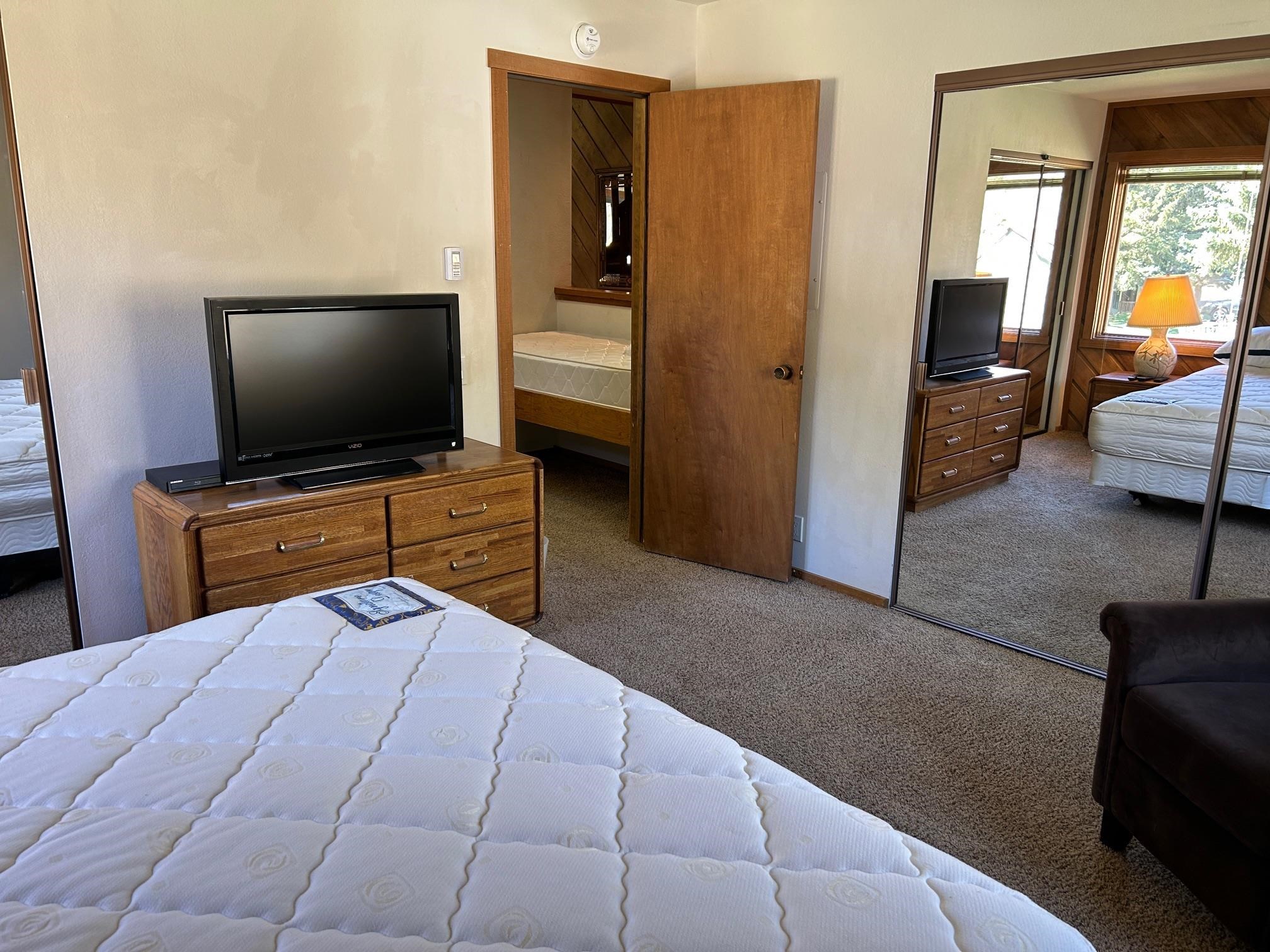 266 Snowcreek Road, Unit 266 Mammoth Lakes, CA 93546 - Photo 19 of 27 a room with furniture and flat screen tv