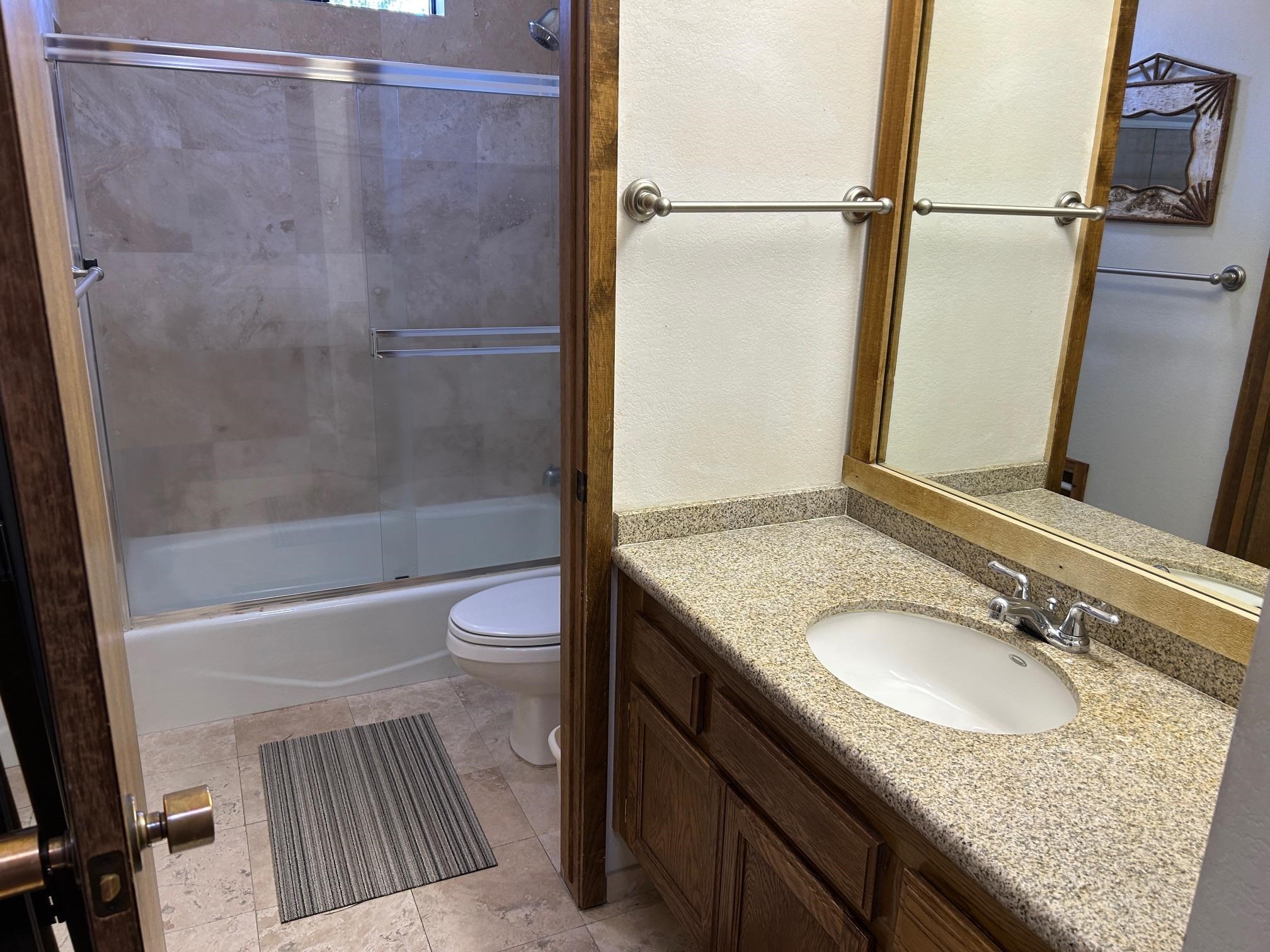 266 Snowcreek Road, Unit 266 Mammoth Lakes, CA 93546 - Photo 20 of 27 a bathroom with a granite countertop sink toilet and shower