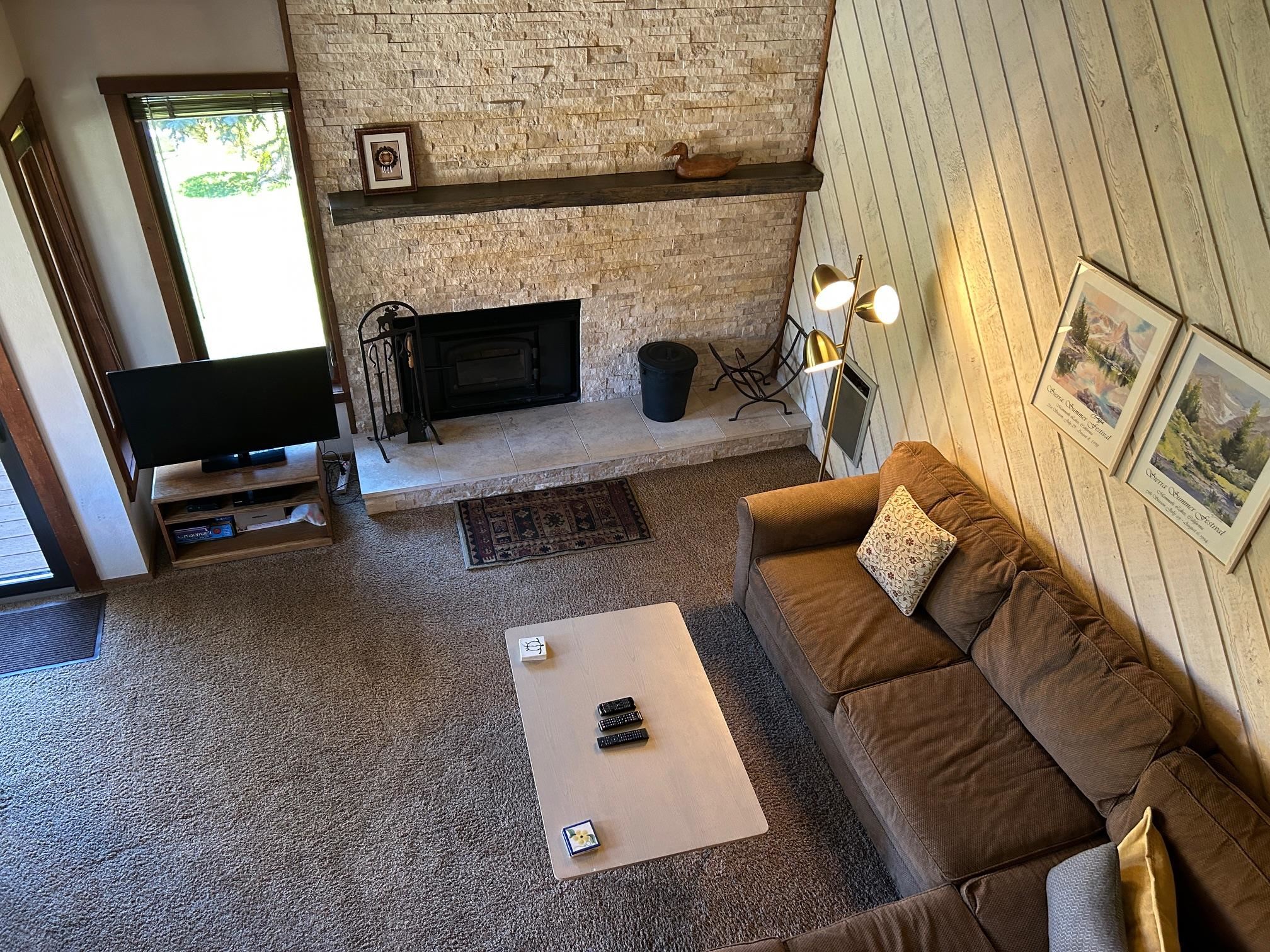 266 Snowcreek Road, Unit 266 Mammoth Lakes, CA 93546 - Photo 8 of 27 a living room with furniture and a fireplace