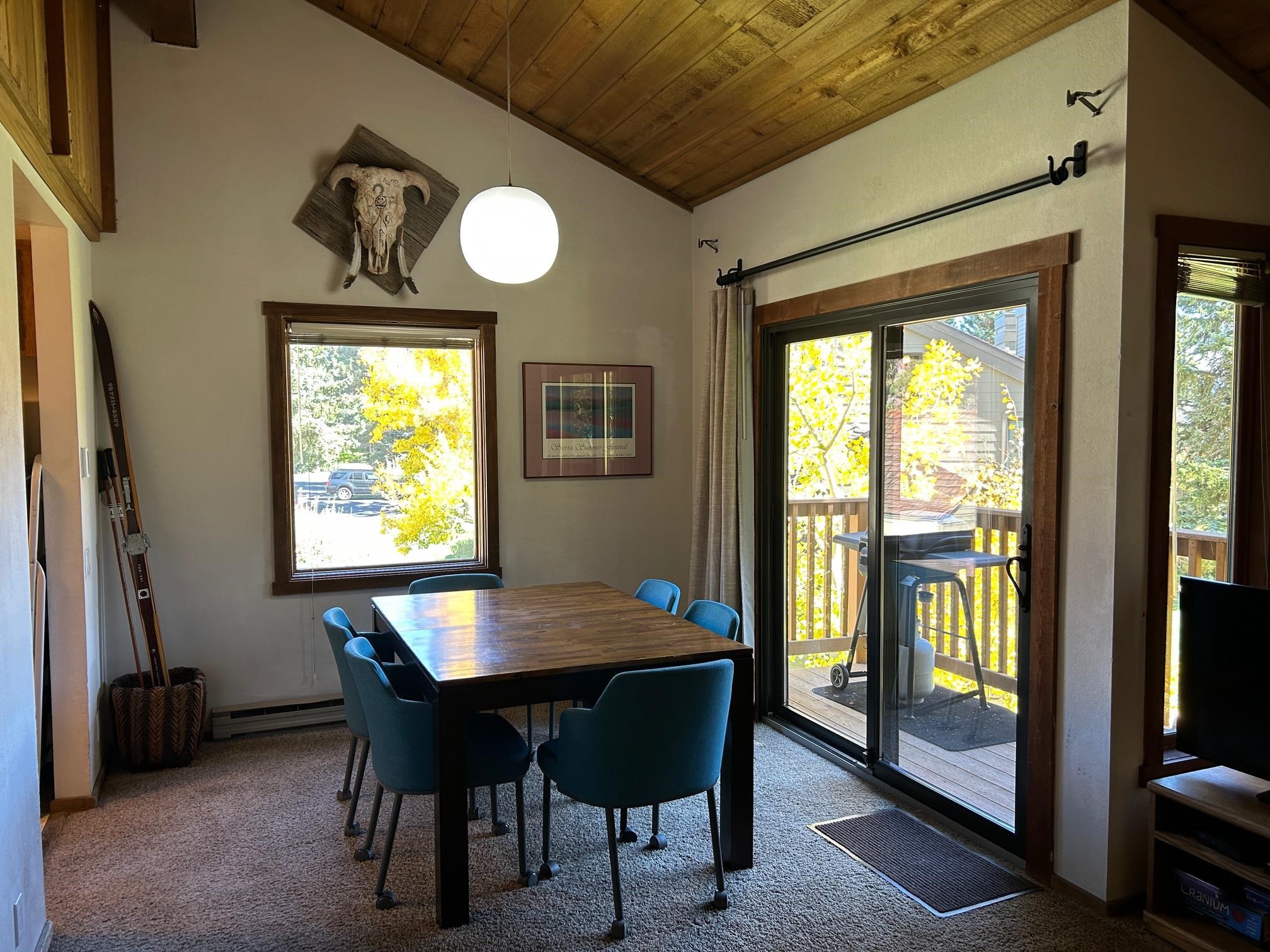 266 Snowcreek Road, Unit 266 Mammoth Lakes, CA 93546 - Photo 9 of 27 a view of a dining room with furniture and a window