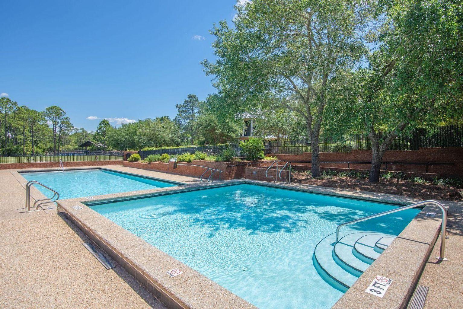 Lot 50 North Pontchartrain Santa Rosa Beach Santa Rosa Beach, FL 32459 - Photo 8 of 17 a view of a swimming pool with a patio and a yard