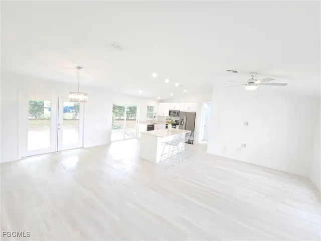 a bathroom with white cabinets