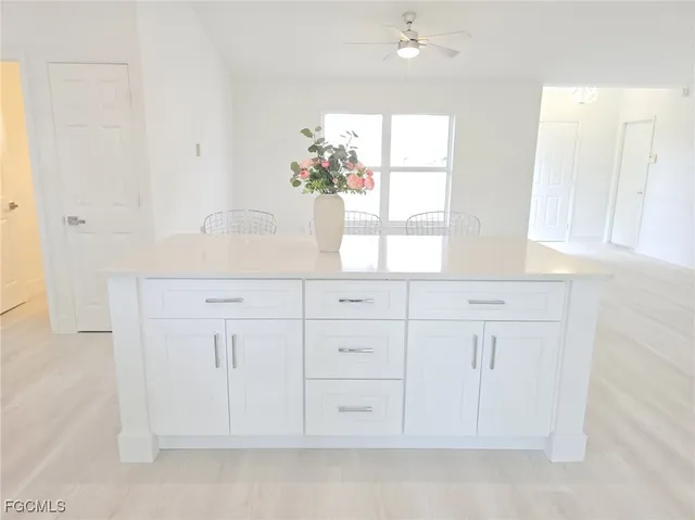 a bathroom with a sink a vanity and a mirror