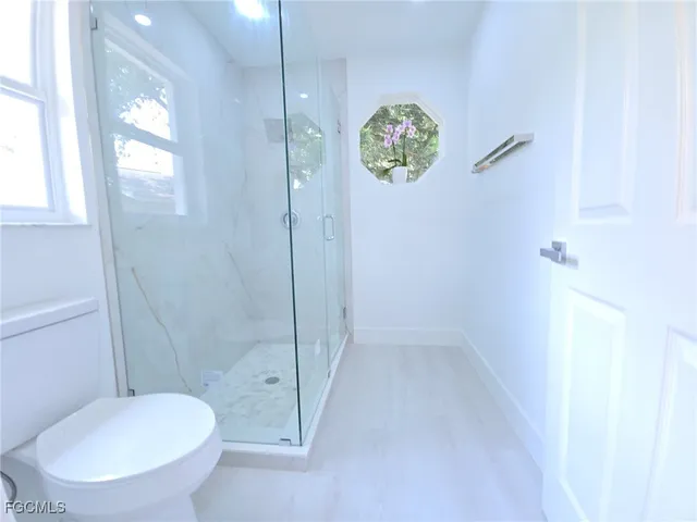 an empty room with a view of bathroom