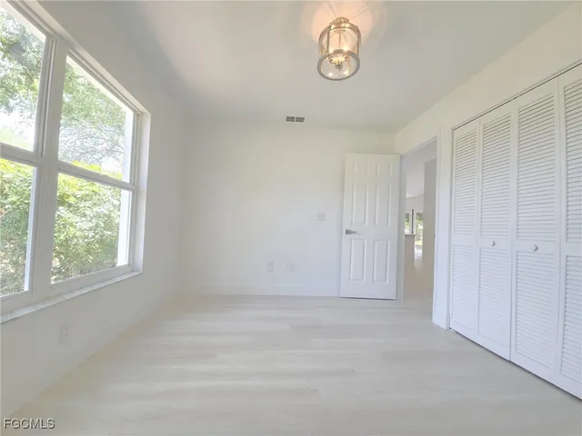 a view of a house with yard and a garden