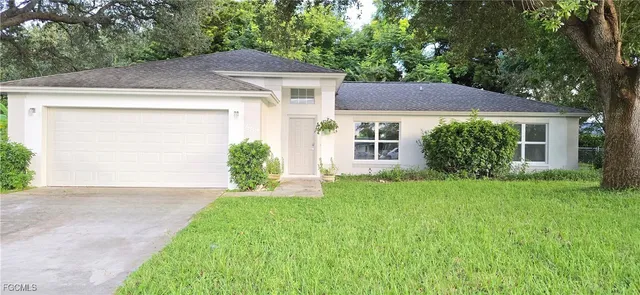 a view of a house with a tree