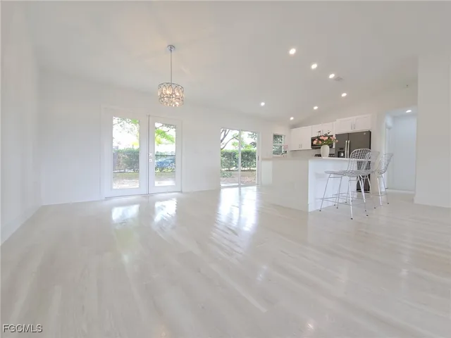 a view of a kitchen with furniture and windows