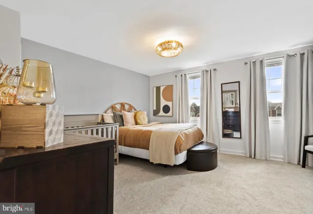 a bed room with bed and a window