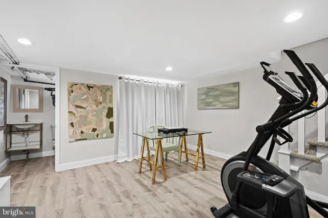 a work room with furniture and wooden floor