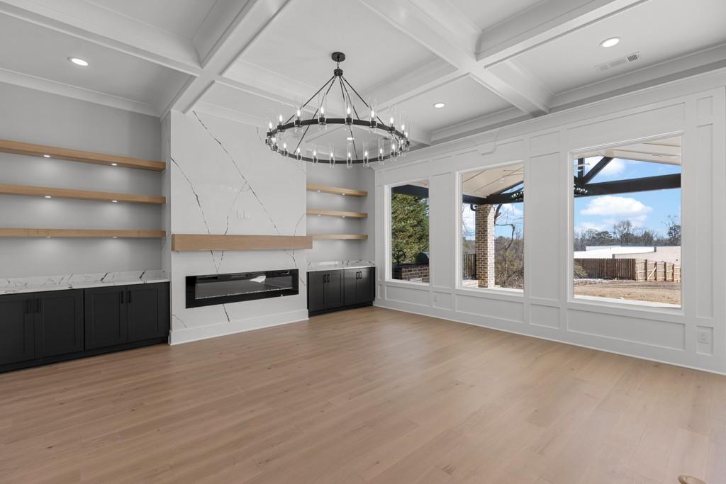 2739 South Waterworks Road Buford, GA 30518 - Photo 12 of 62 a view of an empty room with a window and kitchen view