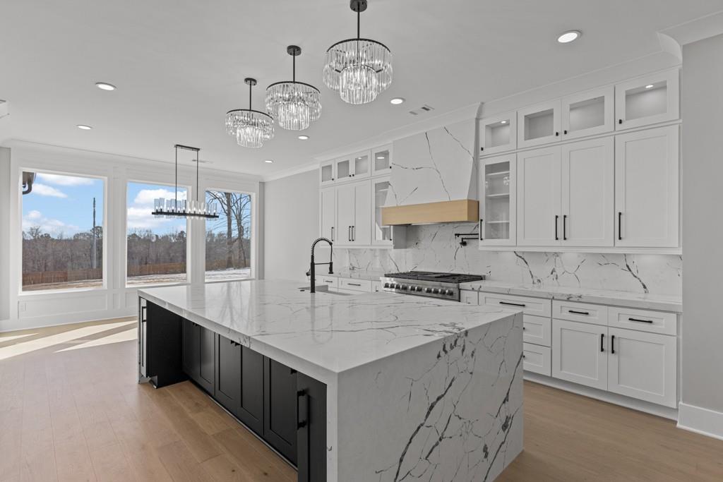 2739 South Waterworks Road Buford, GA 30518 - Photo 18 of 62 a kitchen that has a lot of cabinets in it