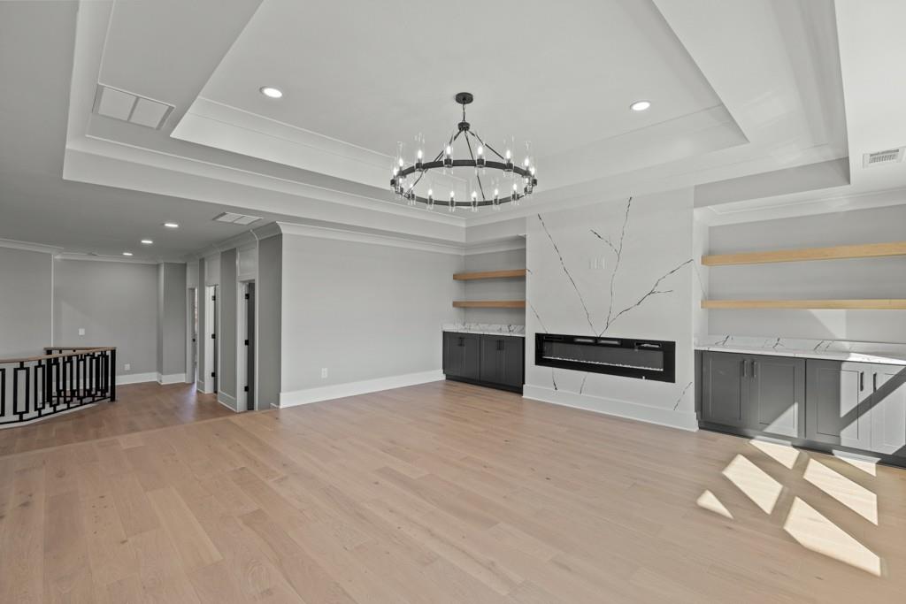 2739 South Waterworks Road Buford, GA 30518 - Photo 35 of 62 a view of an empty room with a window and chandelier