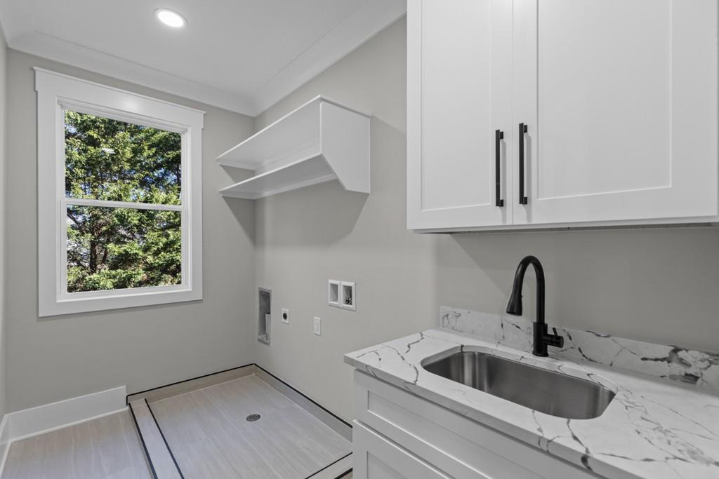 2739 South Waterworks Road Buford, GA 30518 - Photo 45 of 62 a kitchen with stainless steel appliances granite countertop a sink and a window