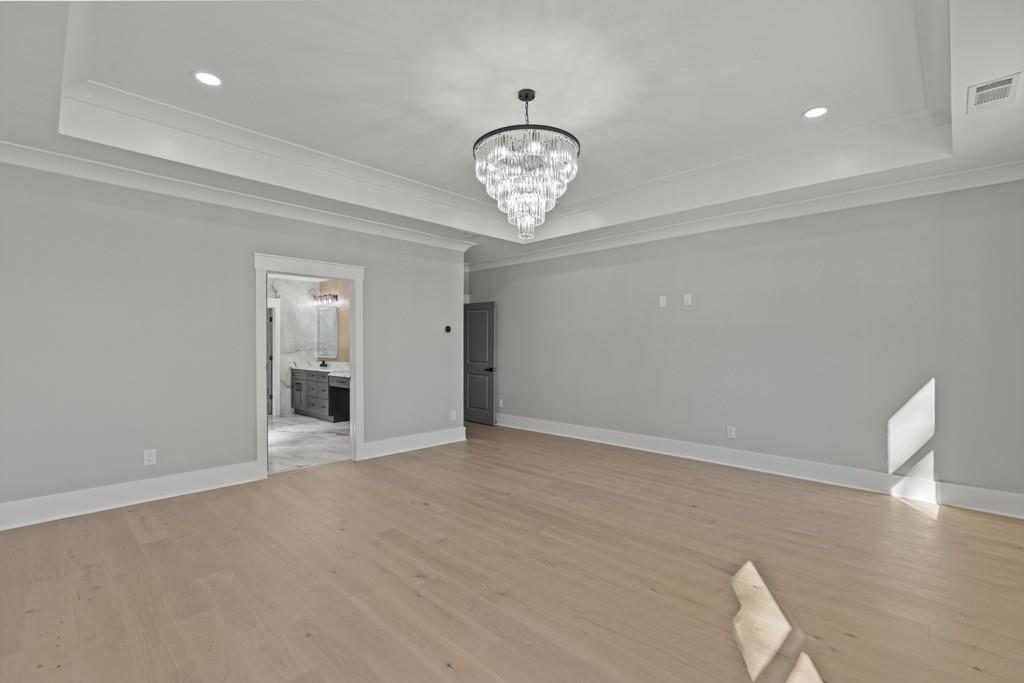 2739 South Waterworks Road Buford, GA 30518 - Photo 51 of 62 wooden floor in an empty room with a window
