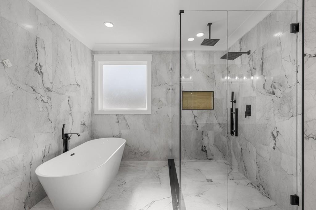 2739 South Waterworks Road Buford, GA 30518 - Photo 53 of 62 a bathroom with a bathtub and shower