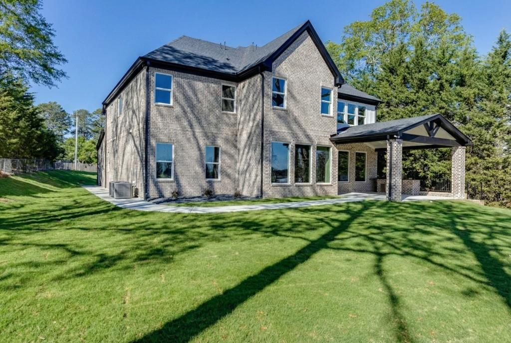 2739 South Waterworks Road Buford, GA 30518 - Photo 60 of 62 a view of a house with backyard and garden