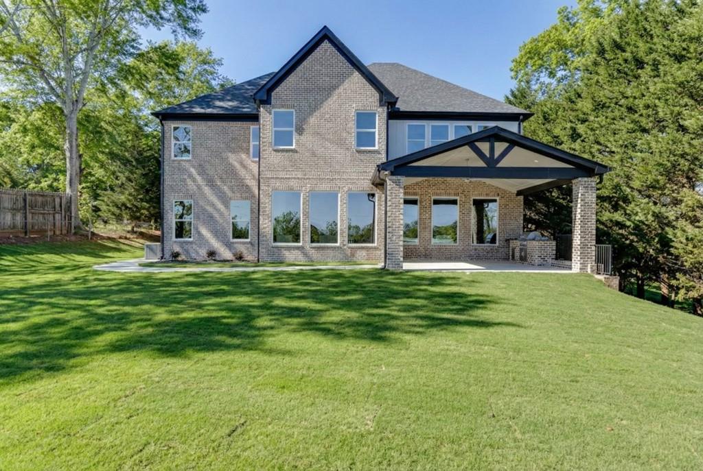 2739 South Waterworks Road Buford, GA 30518 - Photo 61 of 62 a front view of a house with a yard