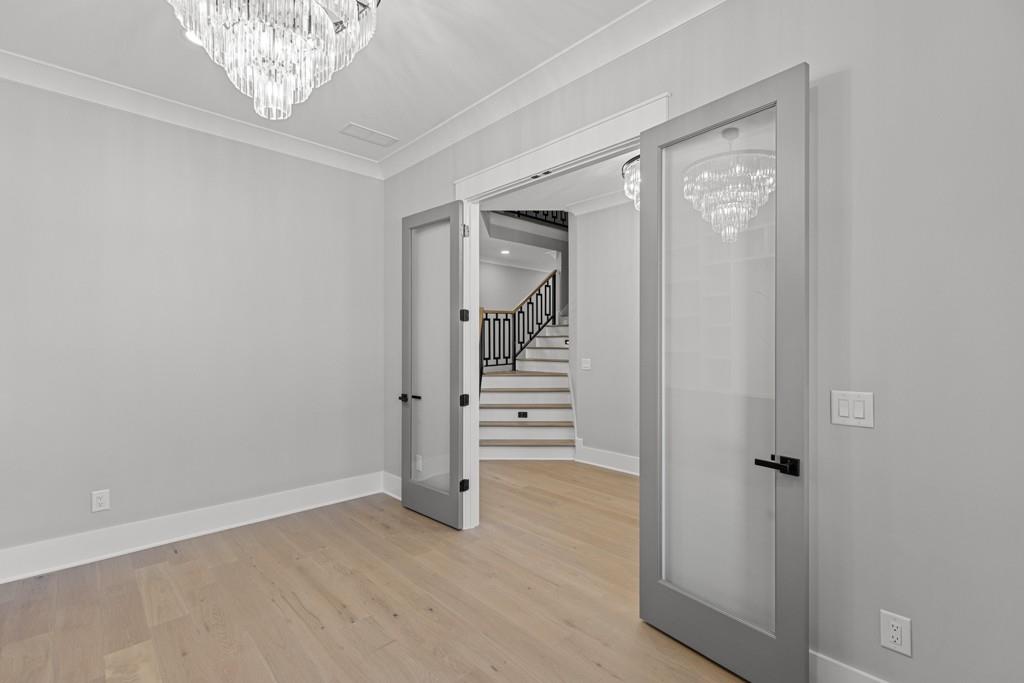 2739 South Waterworks Road Buford, GA 30518 - Photo 7 of 62 wooden floor in a gallery