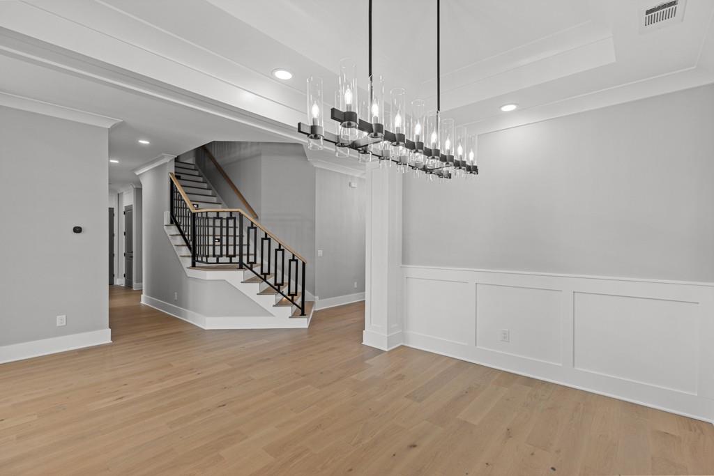 2739 South Waterworks Road Buford, GA 30518 - Photo 10 of 62 a view of a hallway with staircase and kitchen view