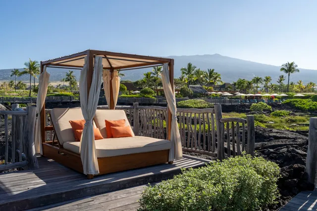 a front view of a house with a garden and patio