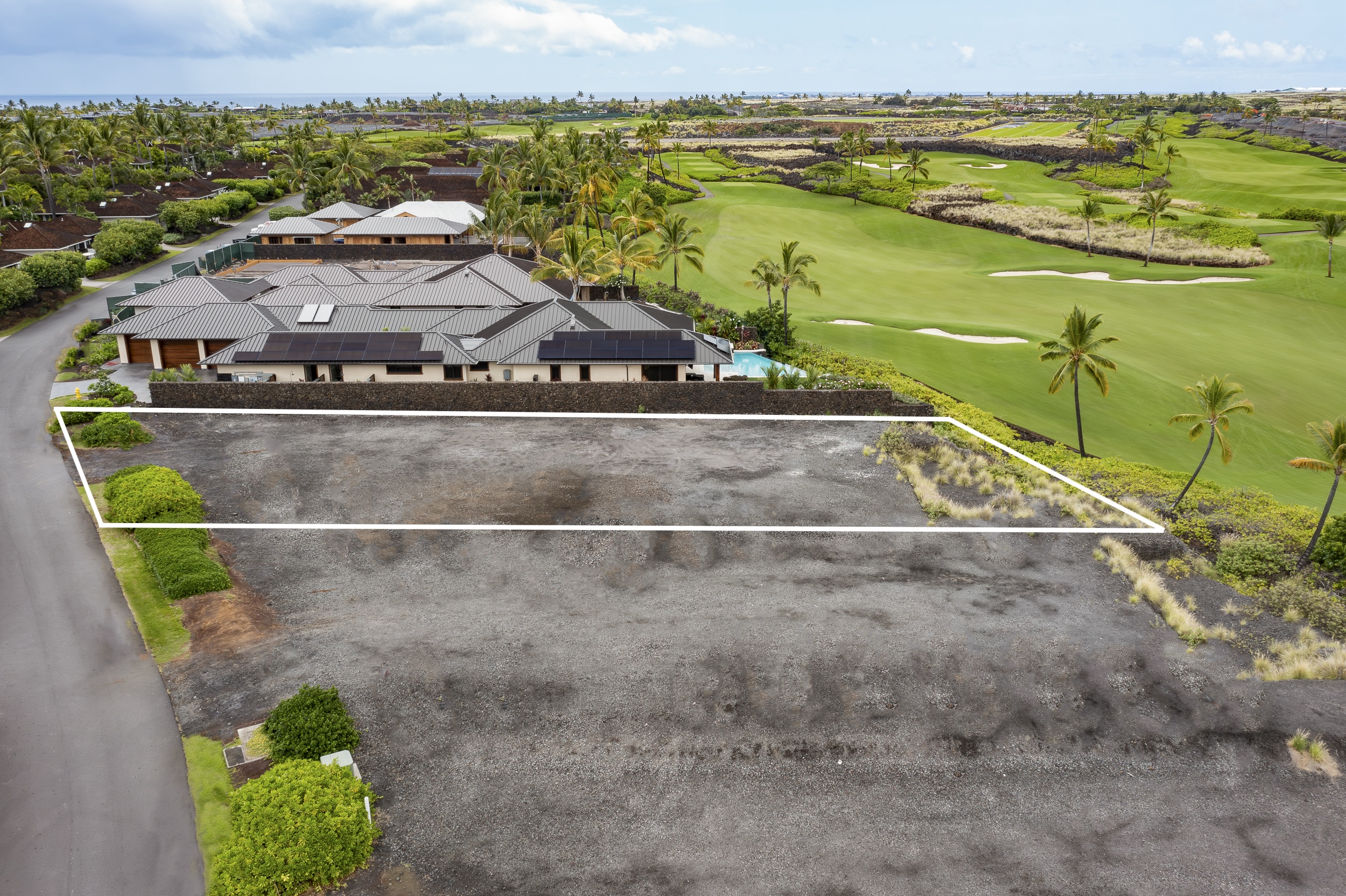73-4861 Lot 11 Maia Loop, Unit LOT 11 Kailua-Kona, HI 96740 - Photo 2 of 15 a view of a lake with a big yard and large trees