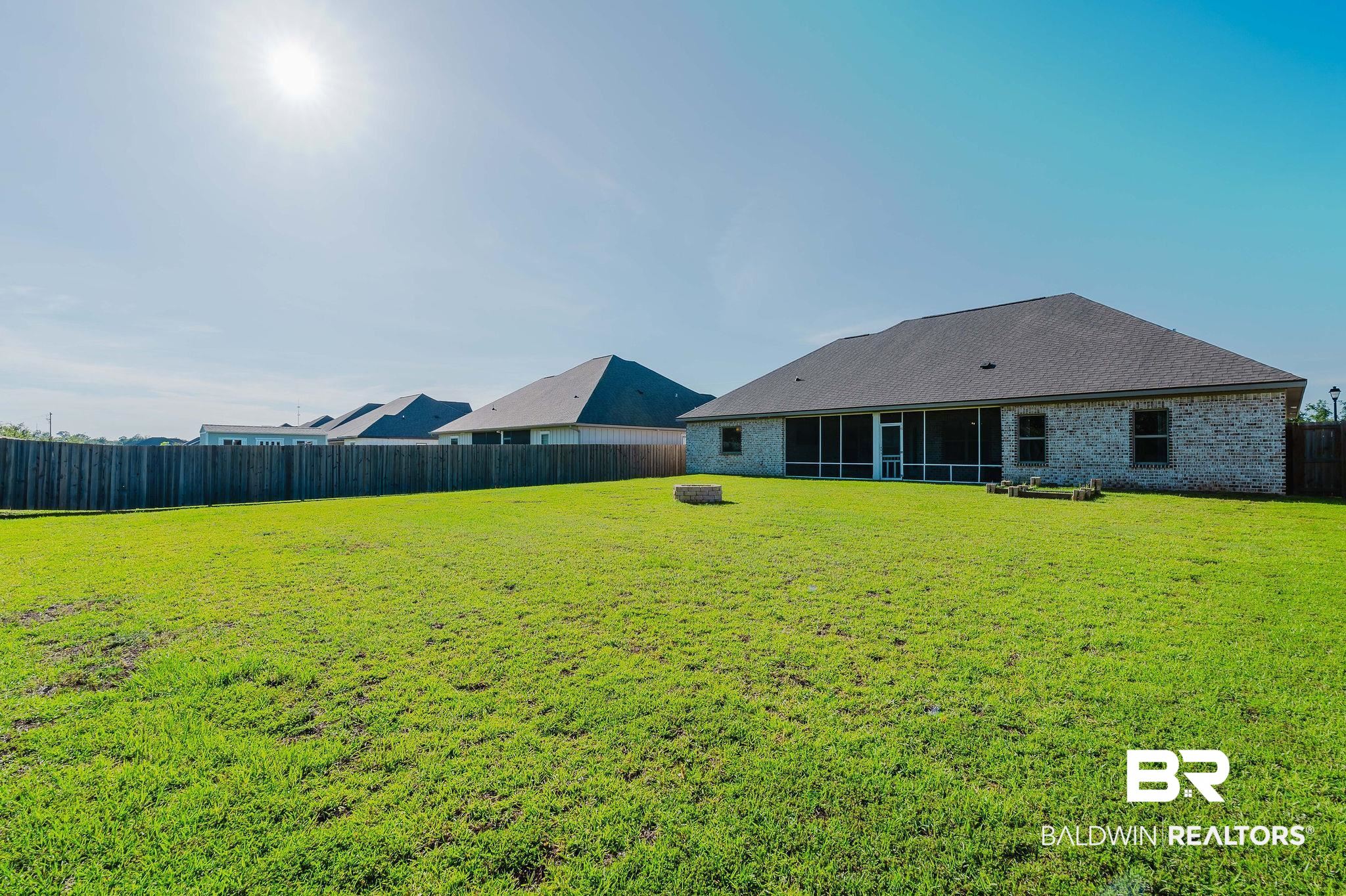 7872 Calverton Street Foley, AL 36535 - Photo 58 of 76 Expansive green lawn with a full privacy fence