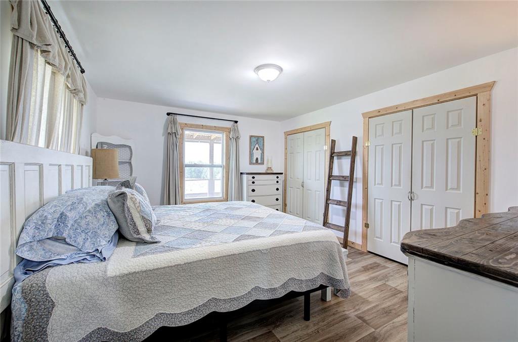 765 Addison Road Buchanan, GA 30113 - Photo 19 of 50 a bedroom with a large bed and a dresser