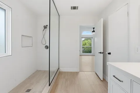 a view of walk in closet with empty racks