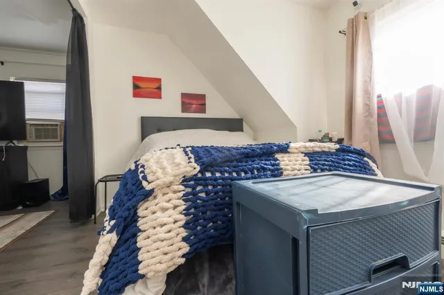 a living room with a bed and a table