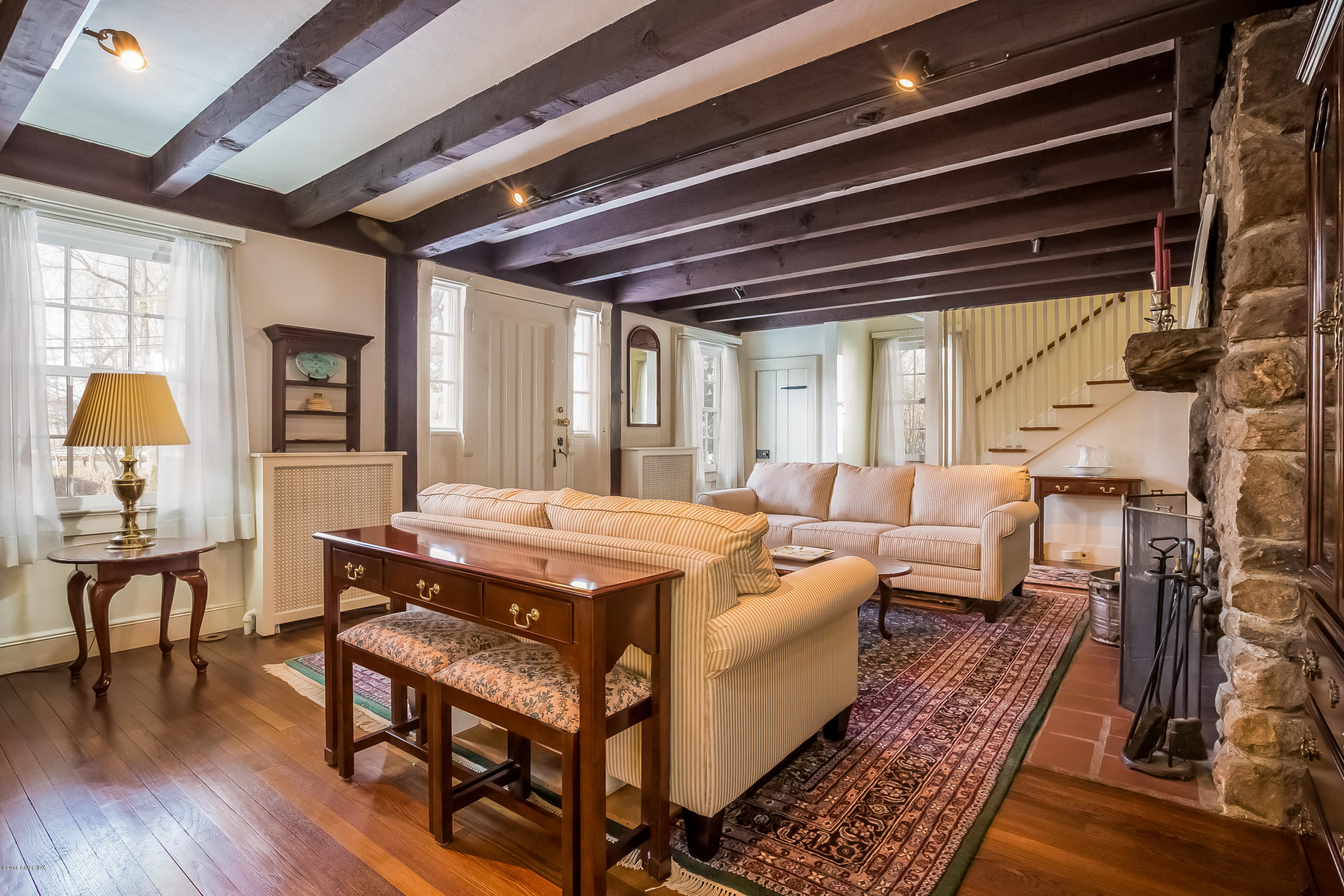 25 Pleasant Street Riverside, CT 06878 - Photo 4 of 17 a living room with furniture and a wooden floor