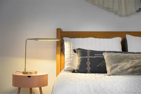 a bedroom with a bed and dresser