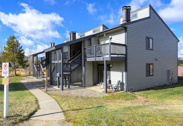 a view of a house with brick walls