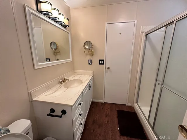 a bathroom with a sink a mirror and a toilet