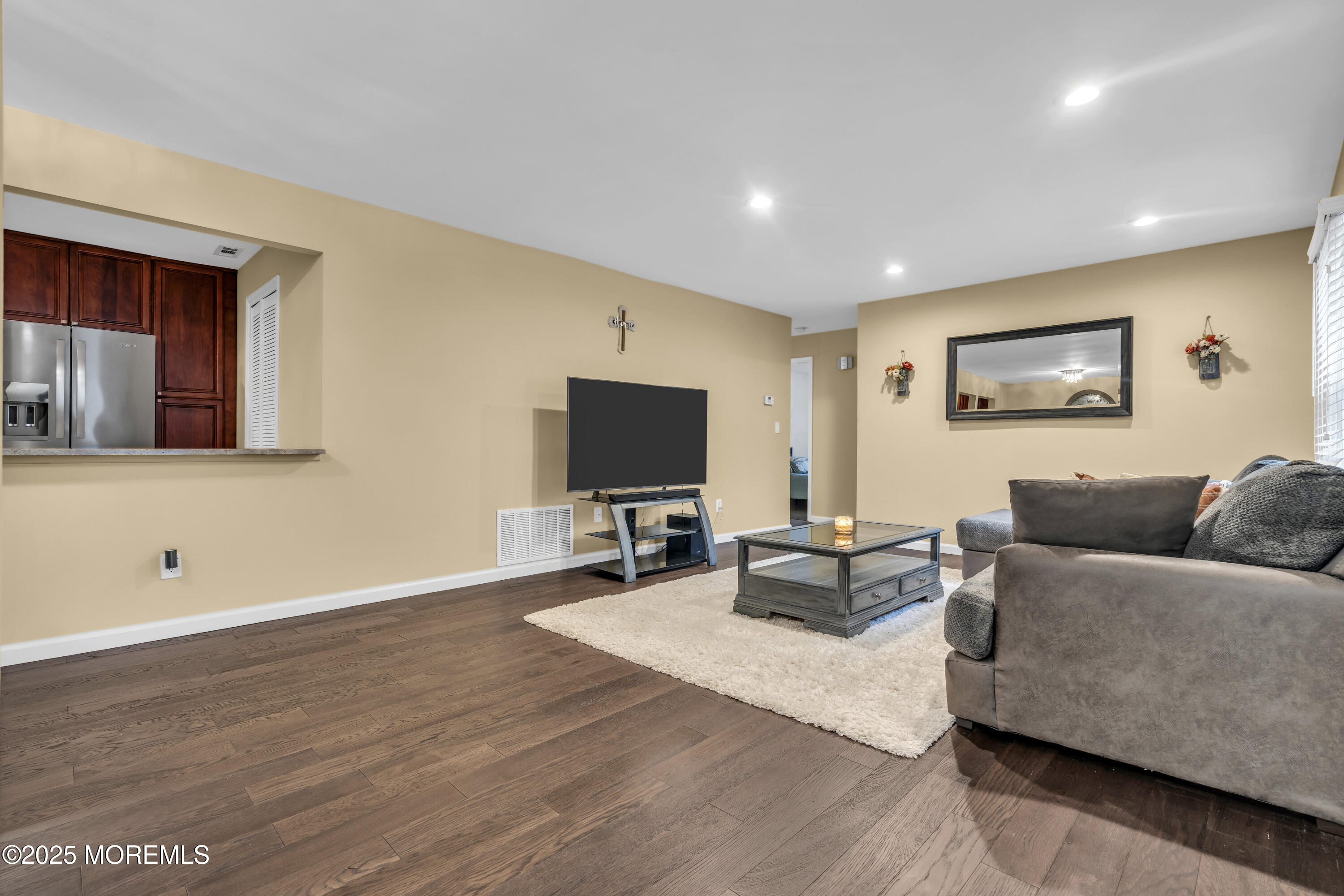 512 Harding Road, Unit 6 Freehold, NJ 07728 - Photo 13 of 36 a living room with furniture and a flat screen tv