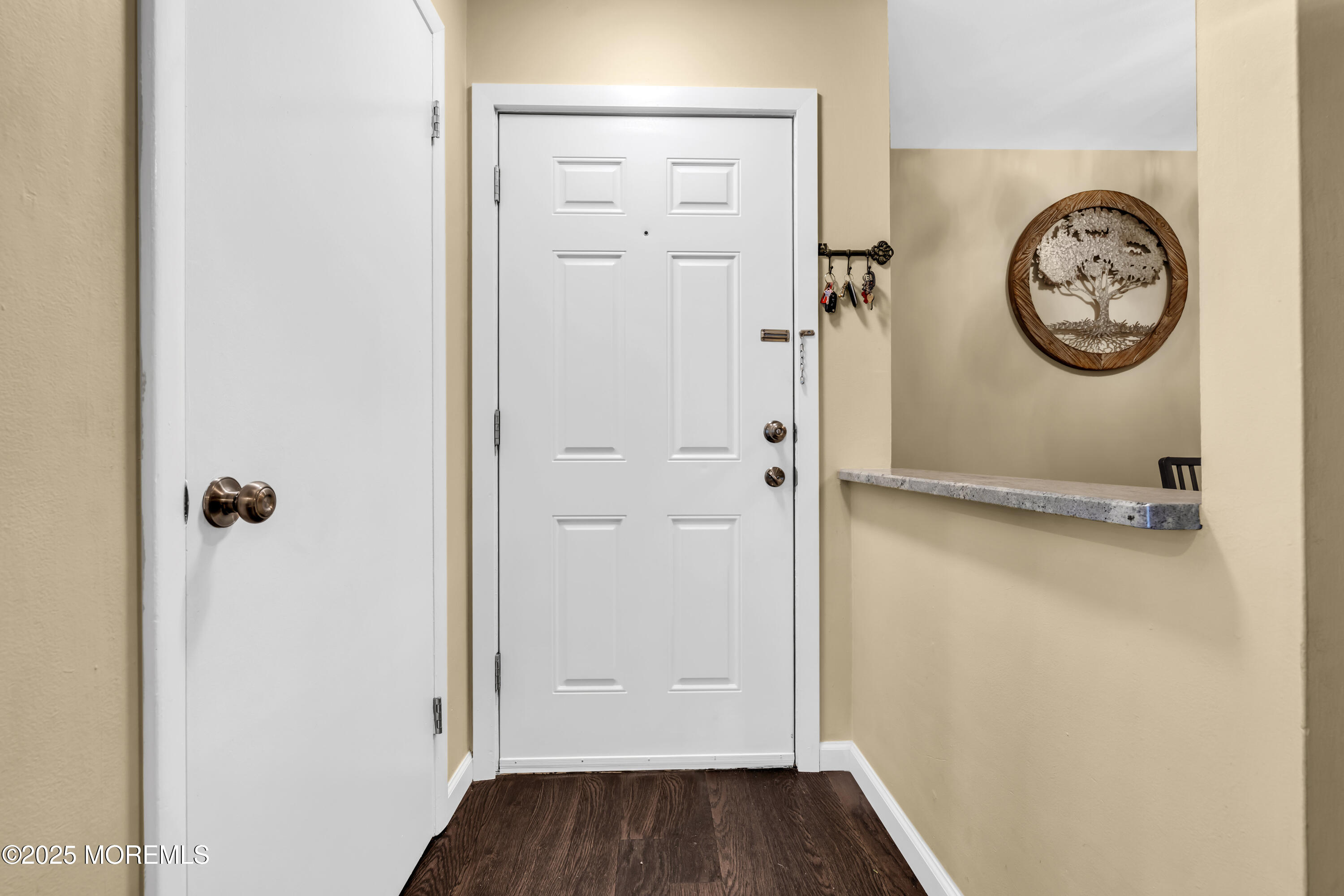 512 Harding Road, Unit 6 Freehold, NJ 07728 - Photo 3 of 36 a view of a hallway with wooden floor