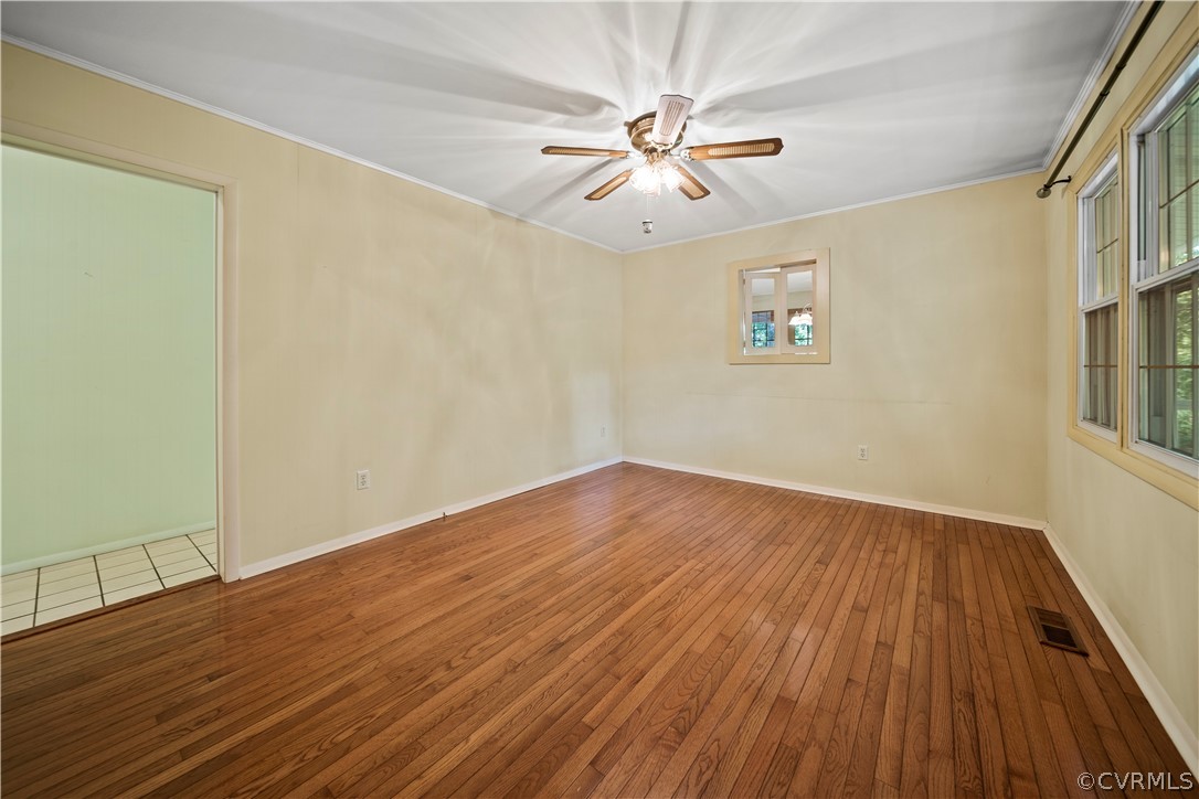 14608 Nash Road Chesterfield, VA 23838 - Photo 15 of 42 a view of an empty room with wooden floor and a window