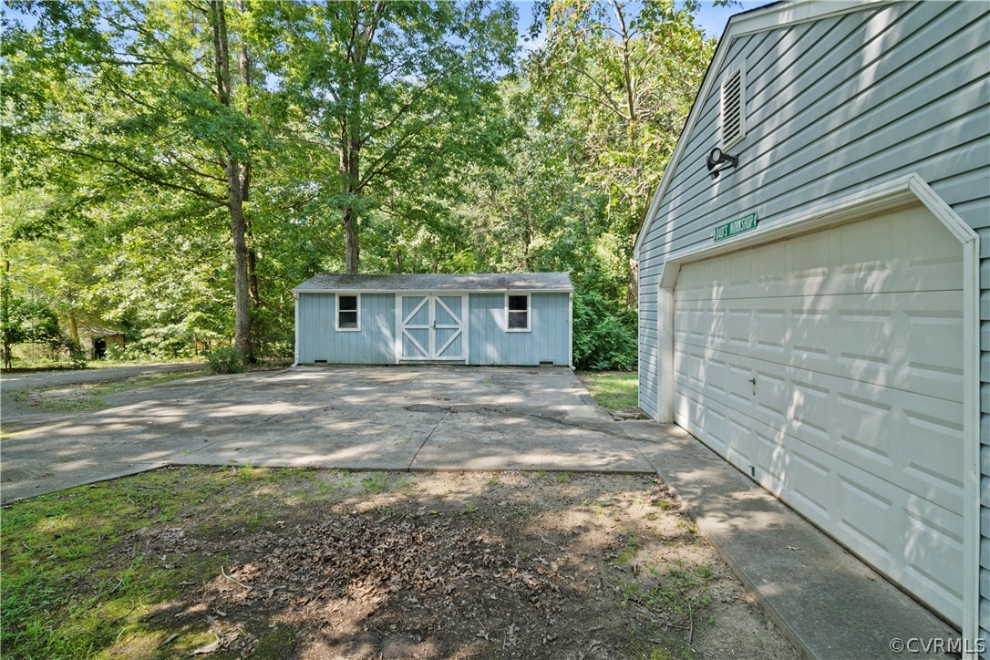 14608 Nash Road Chesterfield, VA 23838 - Photo 3 of 42 a view of a house with a yard and garage