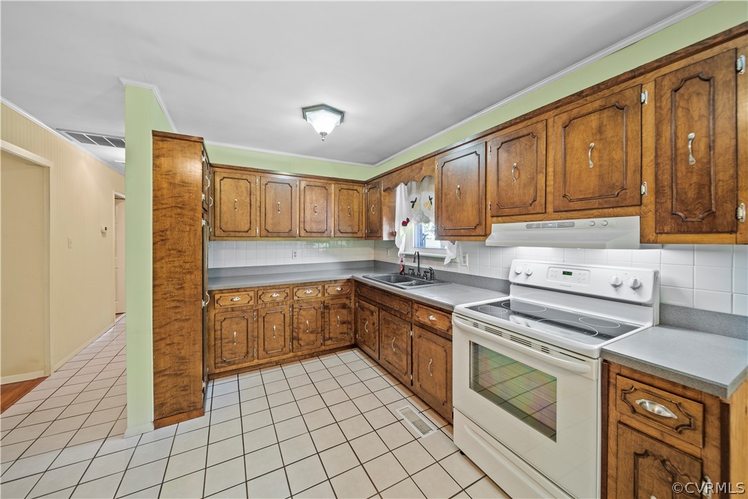 14608 Nash Road Chesterfield, VA 23838 - Photo 5 of 42 a kitchen with a stove sink and cabinets