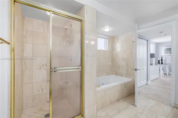 a kitchen with stainless steel appliances granite countertop a refrigerator a stove and a sink